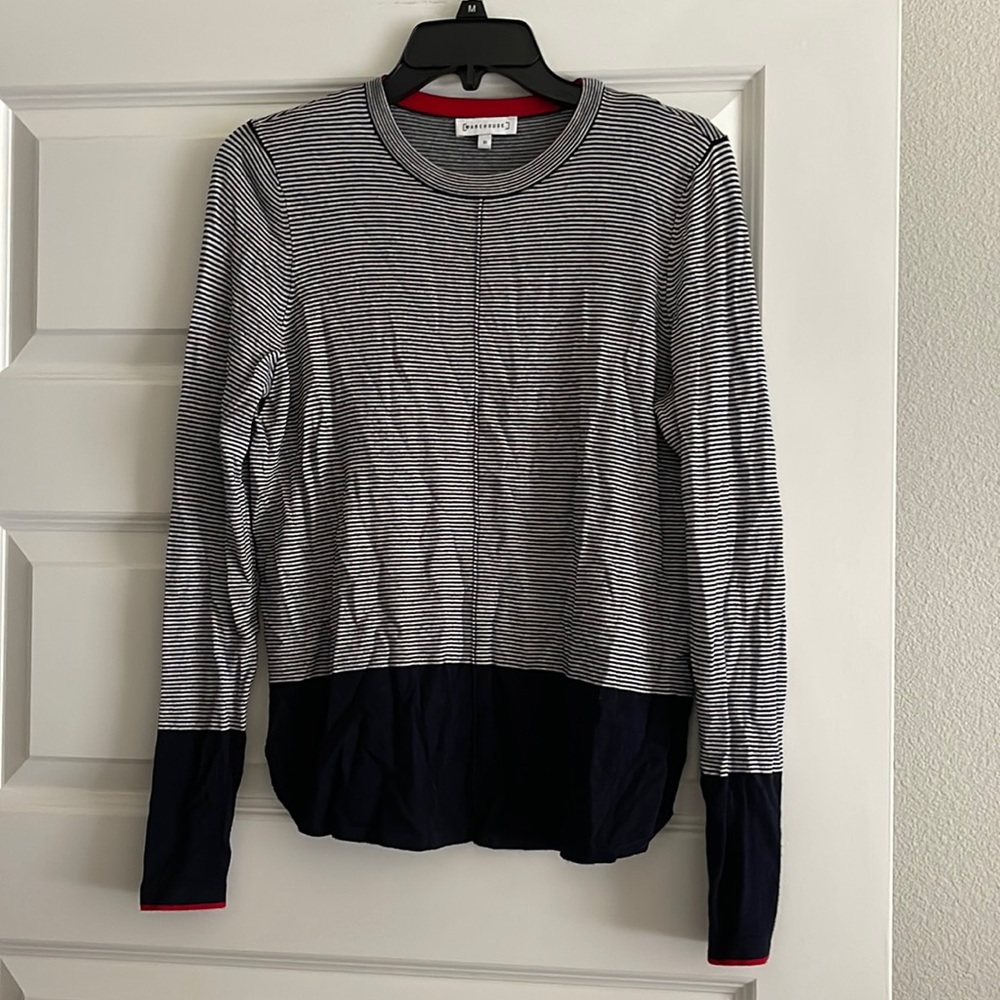 Women’s navy blue and white long sleeve shirt with red details